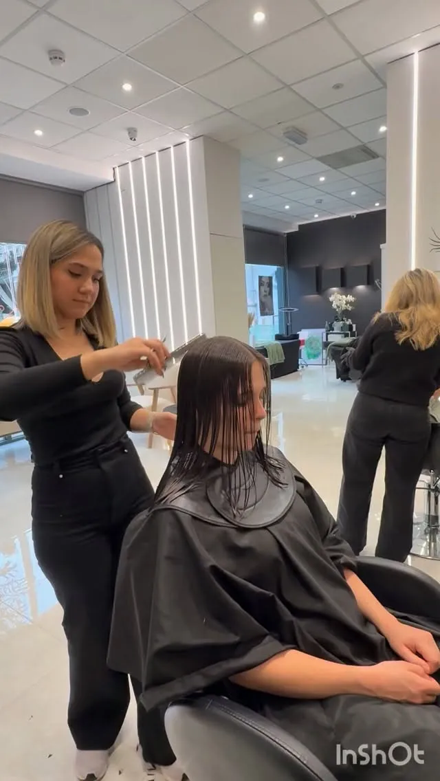 A stylist at work in the AFSOO Beauty salon